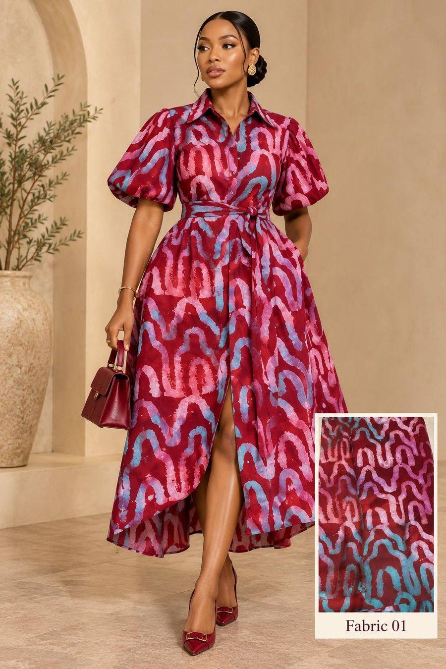 Model in a crimson adire puff-sleeve shirt dress with a high-low hem